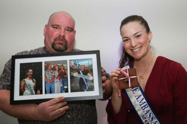 Maddy presented Jason with a gift consisting of a framed photo of memories from last year.